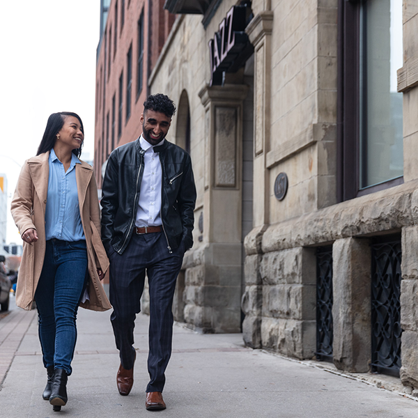 People walking on the sidewalk in Toronto